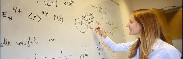 UCR-Stan Lim_ Students writing on white board